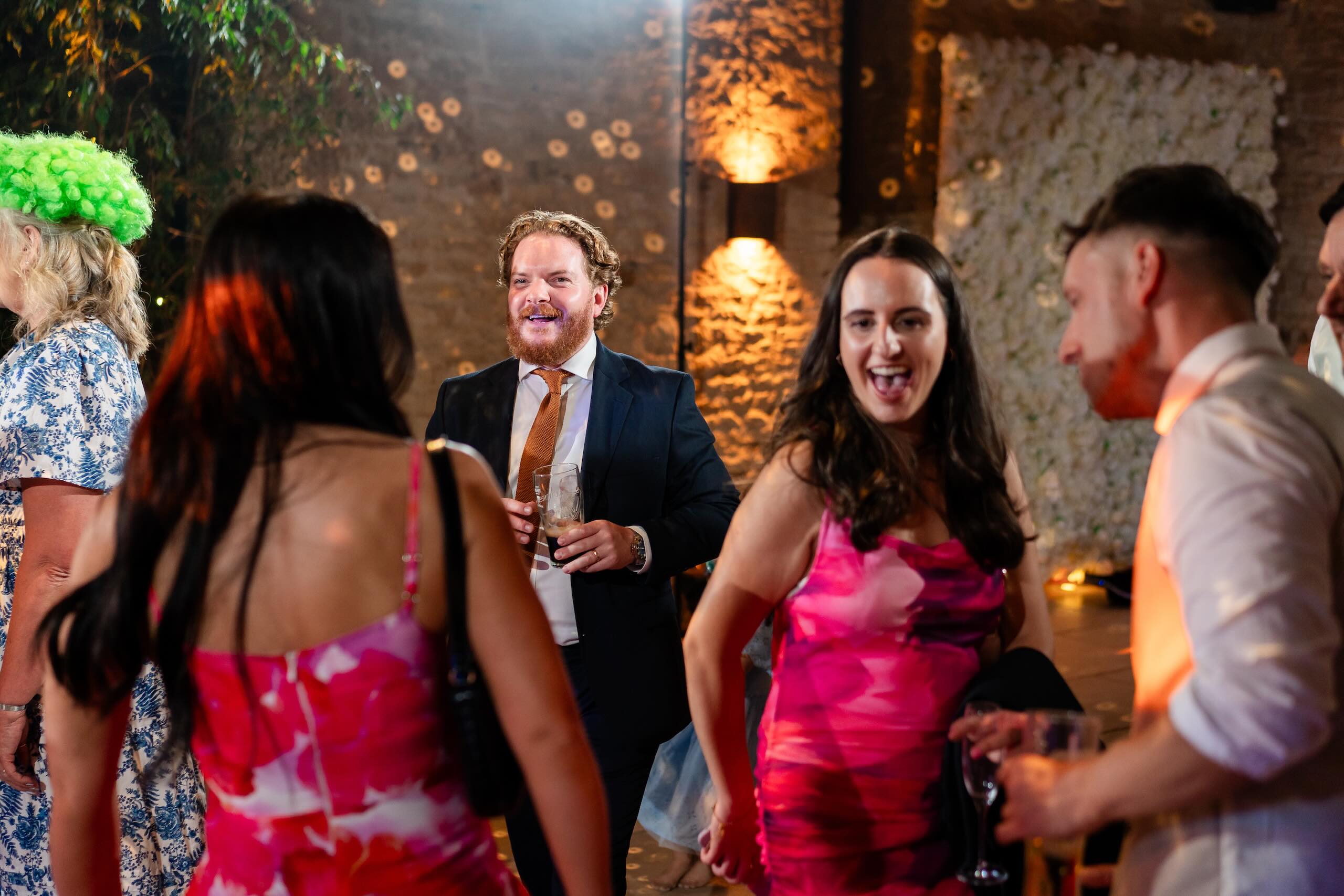 Wedding party celebrating at Old Gore Barn in the Cotswolds