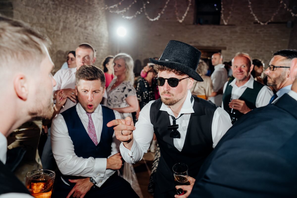 Evening wedding DJ setup for a Cotswold barn reception