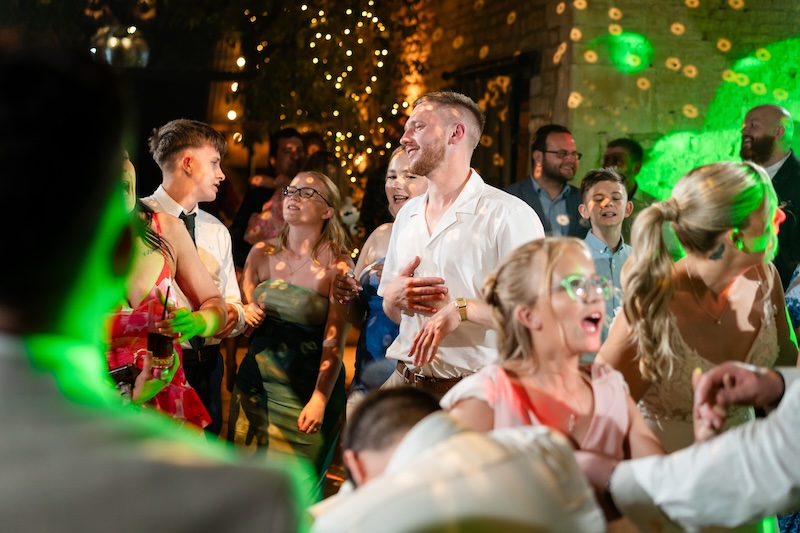 Wedding guests dancing at an Old Gore Barn evening reception