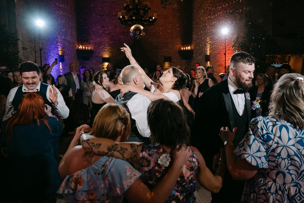Bride and groom dancing together during their Stone Barn wedding reception