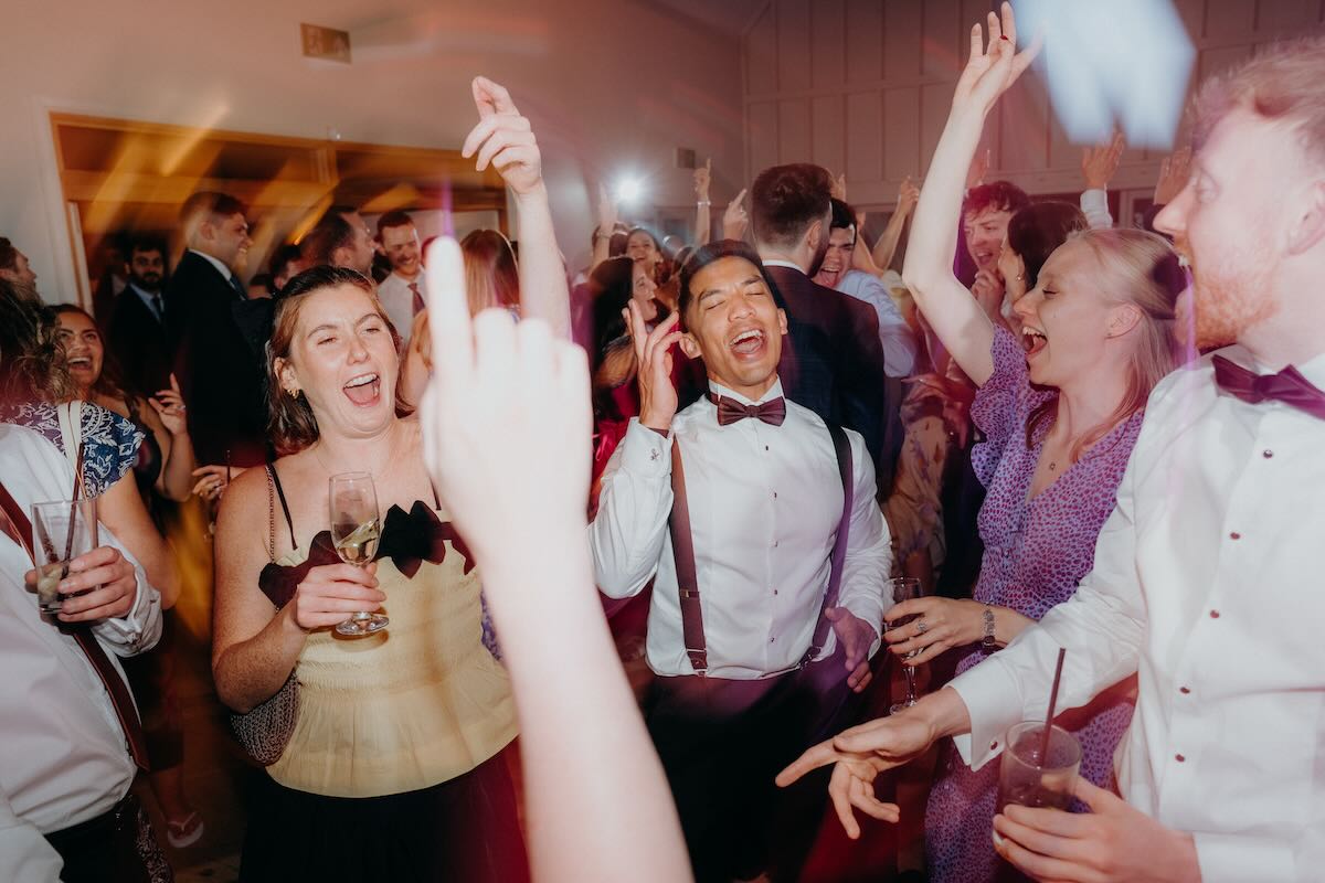 Wedding guests celebrating together at Hyde House